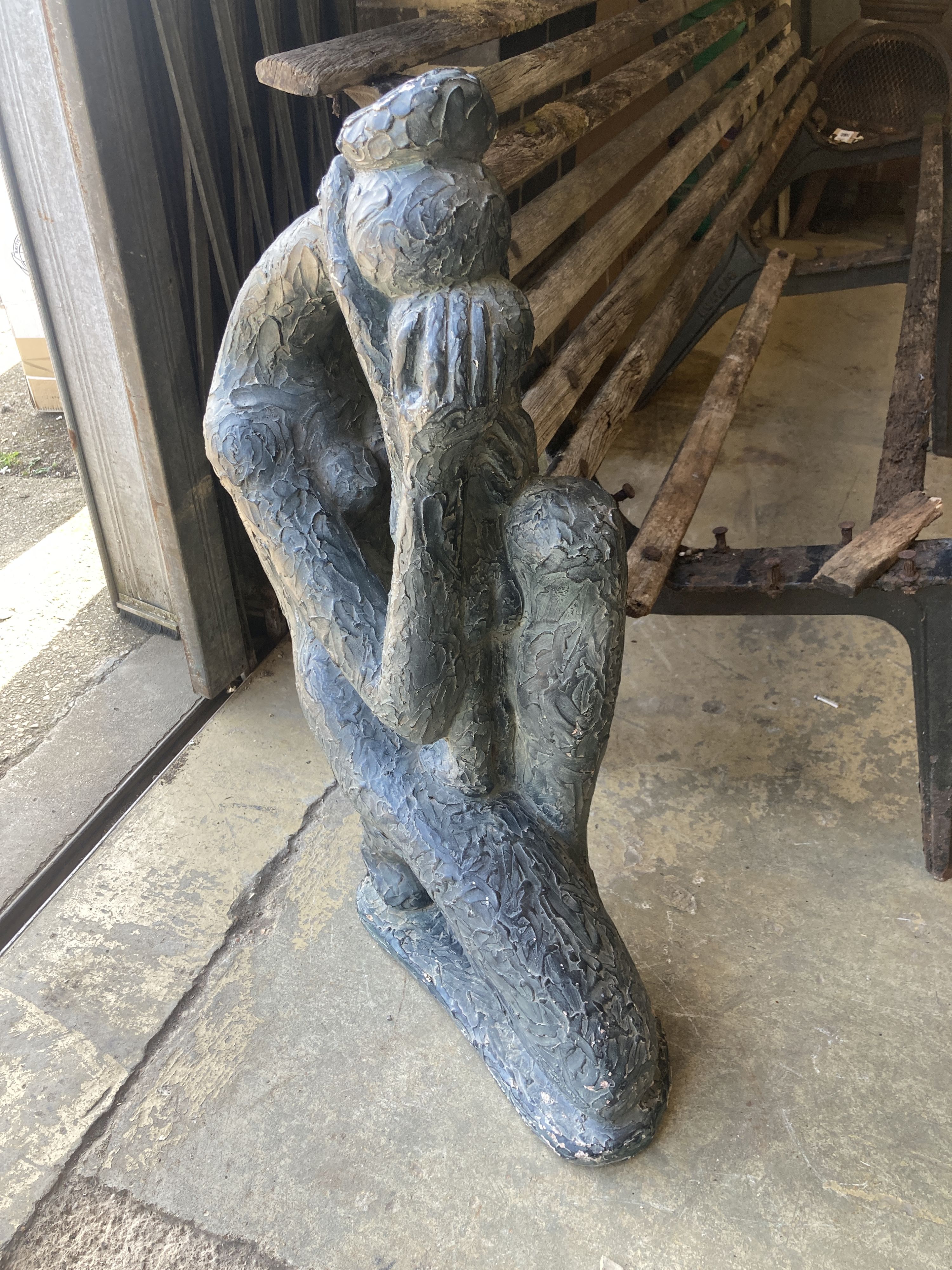 An Austin sculpture Durastone figure of a crouching girl
